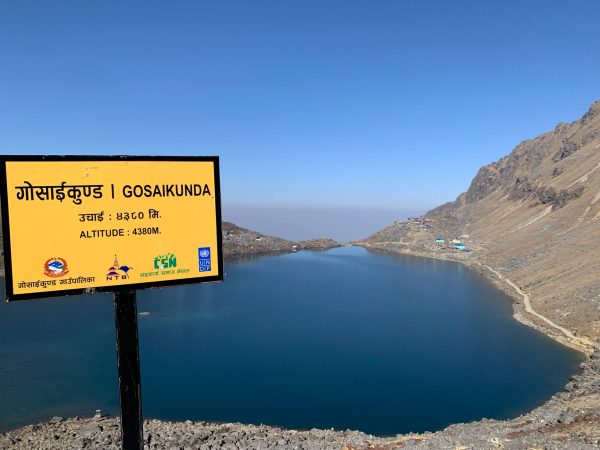 Panoramic view of serene Gosainkunda Lake surrounded by Himalayan mountains
